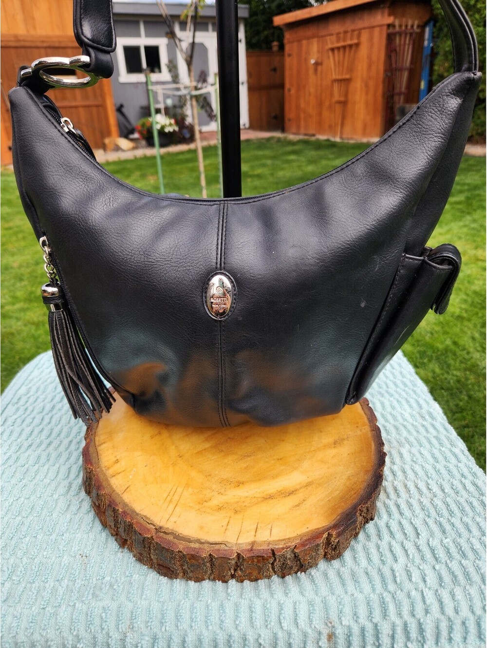 Rosetti Black Leather Shoulder Bag with Tassel Accent